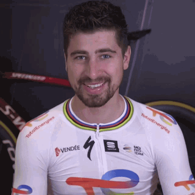 a man wearing a white shirt that says totalenergies and vendee