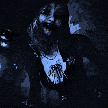 a woman in a witch costume is smiling and looking at the camera