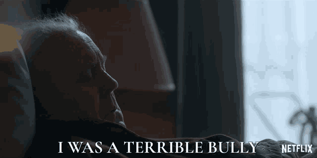 an older man is laying in a bed with the words i was a terrible bully written above him