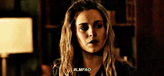 a close up of a woman 's face with the words `` lmfao '' written on the bottom .