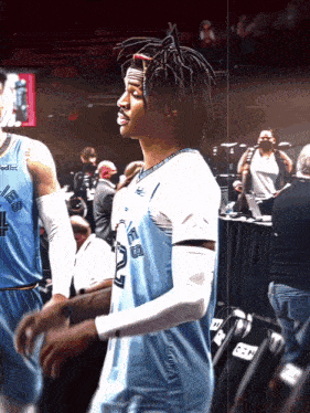 a basketball player wearing a blue jersey with the number 22 on it