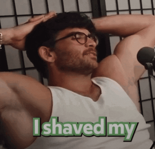 a man in a white tank top with the words i shaved my on the bottom