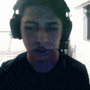 a man wearing headphones and a black shirt
