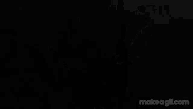 a close up of a red haired anime girl with a black background .