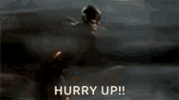 a man is running with a sword in his hand and the words `` hurry up '' are visible .