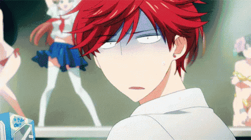 a man with red hair is making a funny face in front of a girl in a bikini
