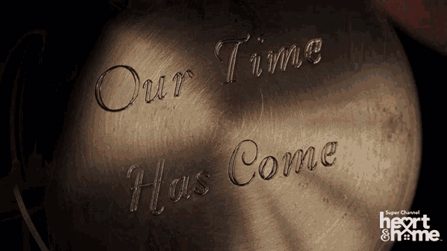our time has come engraved on a metal surface