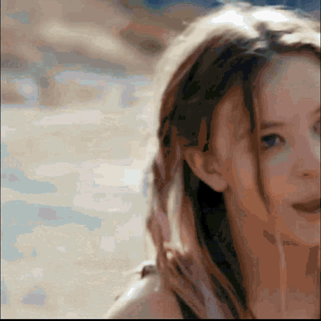 a close up of a woman 's face and hair