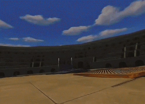 a woman in a white shirt and blue pants is standing in a stadium