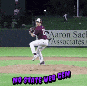 a baseball player with the number 23 on his jersey is about to throw the ball