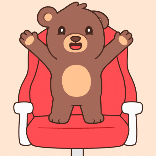 a brown teddy bear is sitting on a red chair