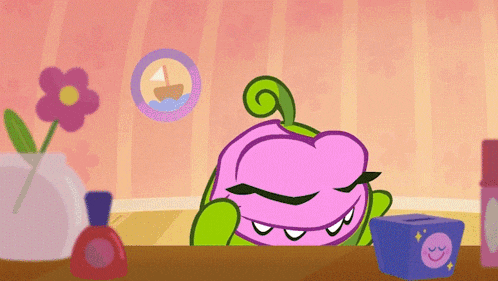 a green cartoon character is talking on a pink telephone