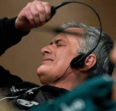 a man wearing headphones and a shirt that says champions