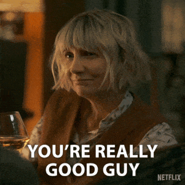 a woman holding a glass of wine with the words you 're really good guy on the bottom