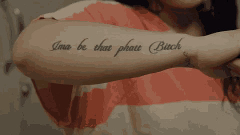 a woman has a tattoo on her arm that says ima be that phat bitch