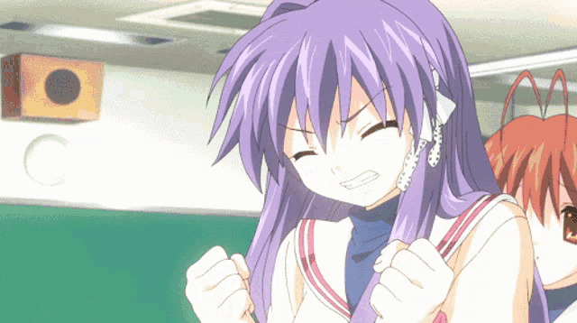 a girl with purple hair has her fist in the air while another girl looks on