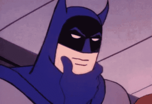 a cartoon batman is holding his hand to his face and making a funny face .