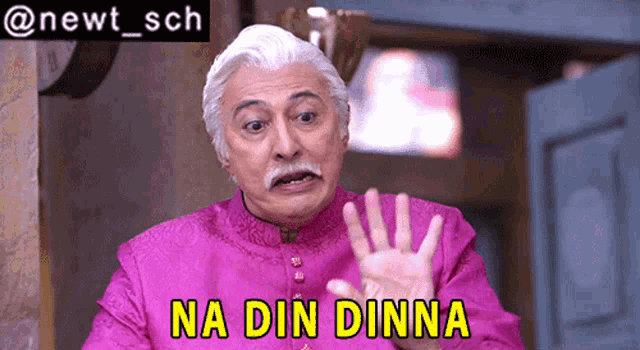a man in a pink shirt with the words na din dinna above him