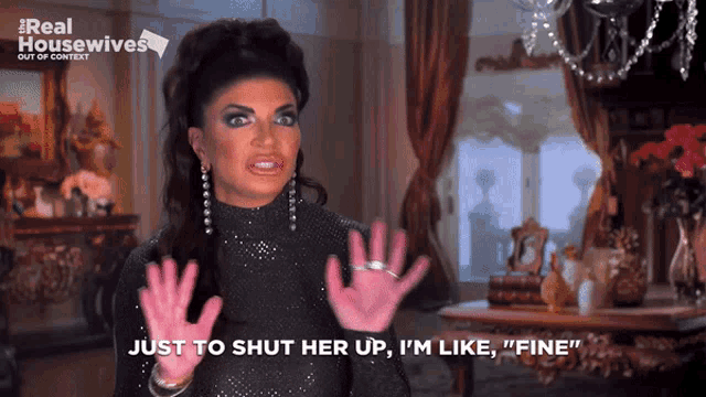 a woman wearing pink gloves says " just to shut her up "