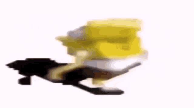 a blurry picture of a spongebob squarepants toy with a black leg .