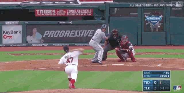 a baseball game is being played in front of a progressive ad