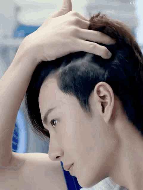 a close up of a person 's head with the word chi on the bottom right