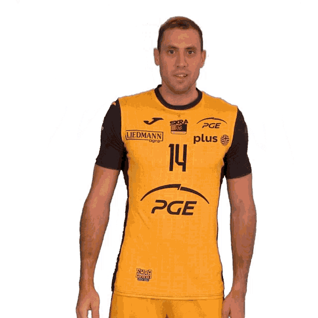 a man is wearing a yellow pge jersey