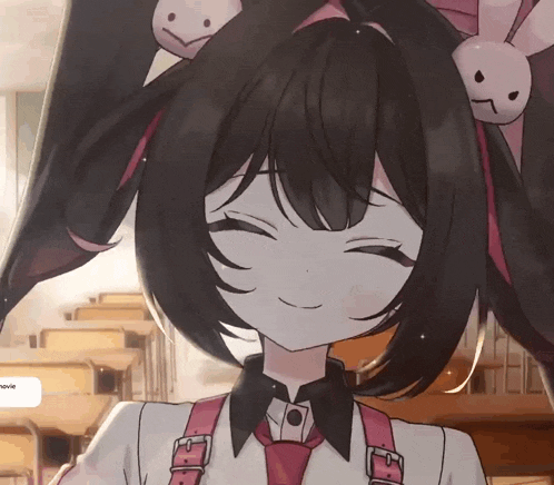 a girl with black hair and bunny ears is smiling in a classroom