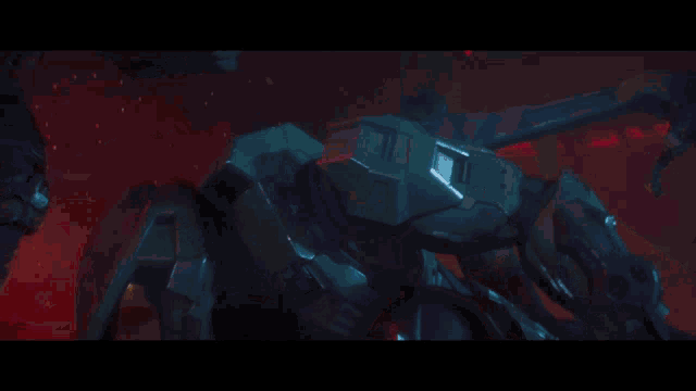 a person is holding a sword in a dark room with red lights behind them