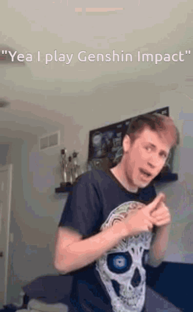 a man in a skull shirt is giving a thumbs up while standing in a room .