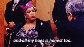 a woman with a purple crown on her head says " and all my hoes is honest too "