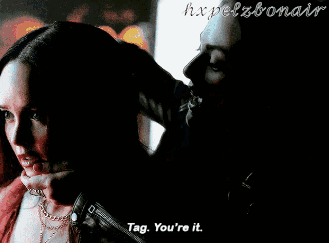 a blurry picture of a man and a woman with tag you 're it