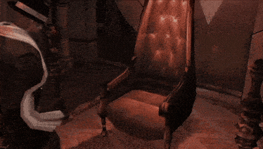 a man in a suit and hat is sitting in a chair with his arms outstretched