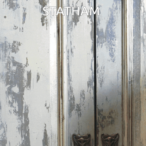a close up of a door with the word statham above it