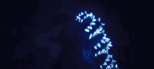 a blue light is coming out of a dark cave