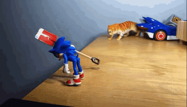 a toy sonic with a red white and blue hat is standing on a wooden table