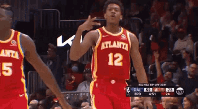 a basketball player wearing a jersey that says atlanta 12