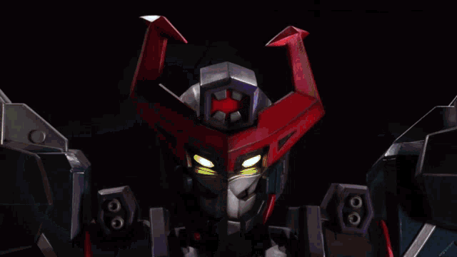a close up of a robot 's face with a red star on it