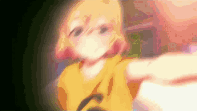 a blurry picture of a girl with a yellow shirt