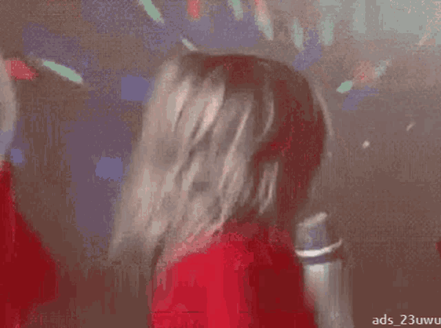 a little girl in a red shirt with a candy cane on it