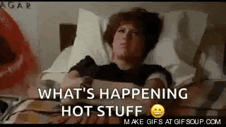 a woman is laying in a hospital bed with the words `` what 's happening hot stuff '' written on the bottom .