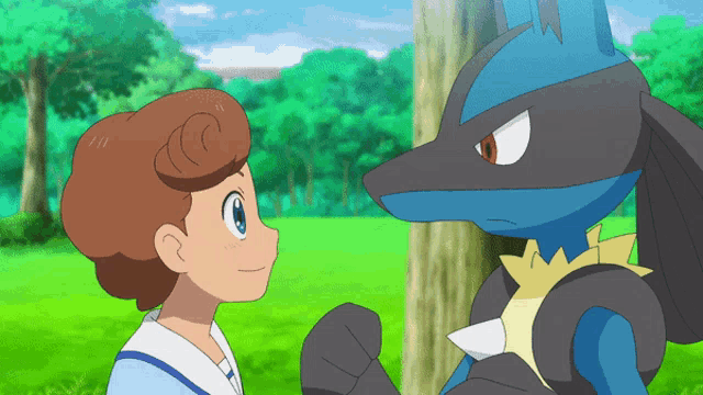 a boy and a pokemon are standing next to each other in a park