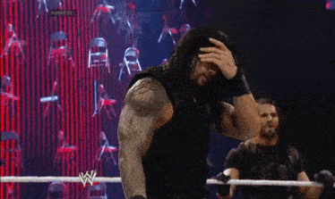 roman reigns is a wrestler with long hair and a beard .