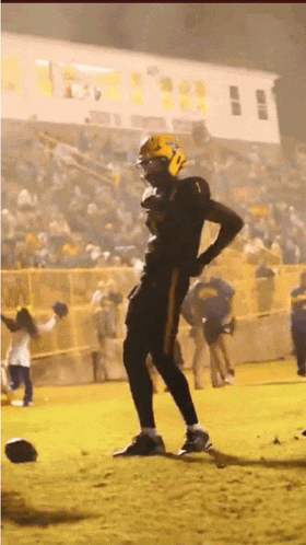 a football player wearing a yellow helmet with the number 1 on it