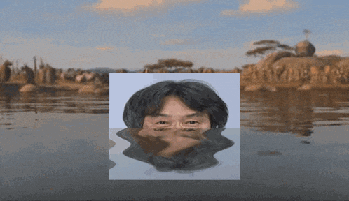 a picture of a man 's face floating in a body of water