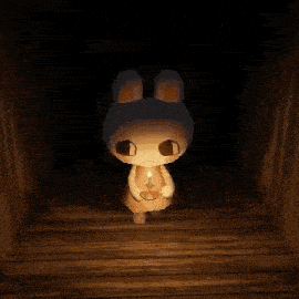 a bunny rabbit is holding a candle in a dark room .
