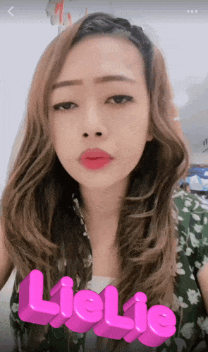 a woman 's face is displayed with the name lielie in pink letters