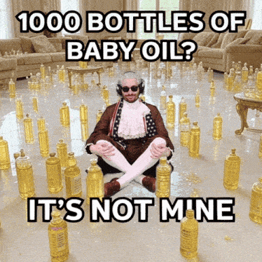 a man is sitting on the floor surrounded by bottles of baby oil