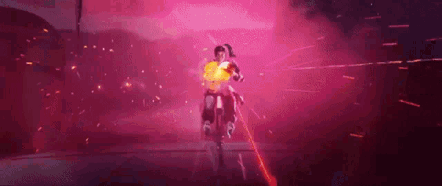 a person is holding a sword in a video game and a red light is coming out of the sword .