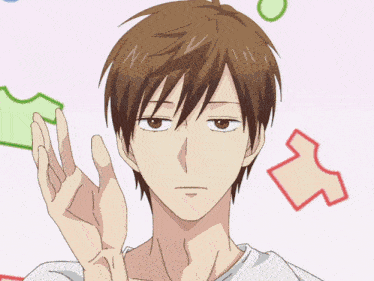 a man with brown hair giving a thumbs up